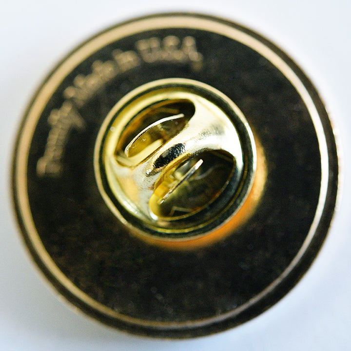 The back side of the pin on white.