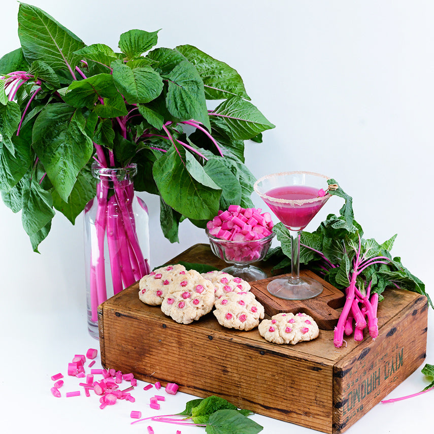 Chopped juiced and cookies made from Pink Beauty Amaranth on a white background.