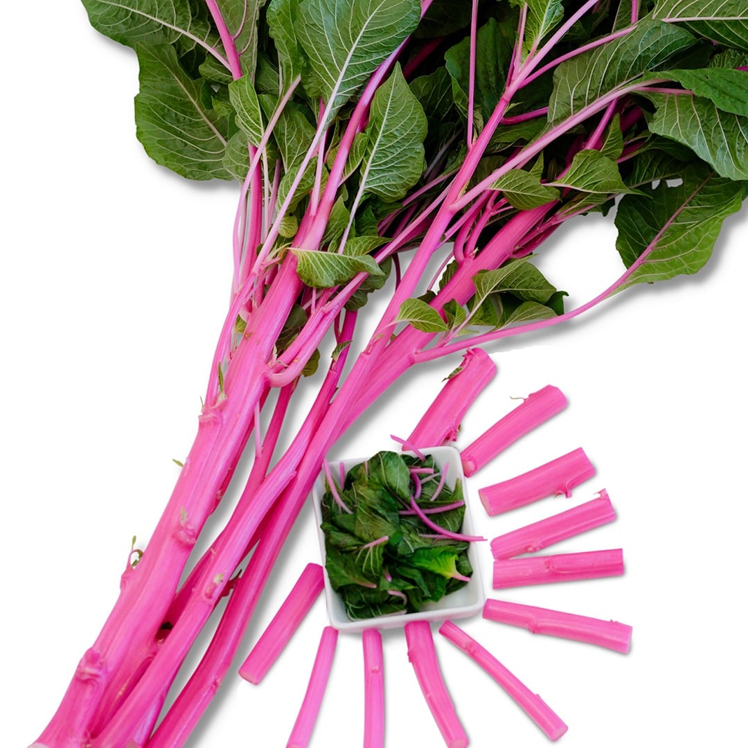 Pink Beauty Amaranth stalks with leaves in small white bowl.
