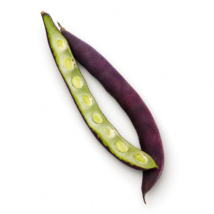 A sliced and whole Purple Podded Pole Beans on a white background.