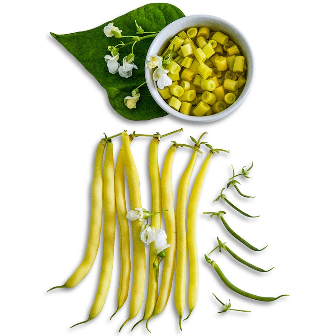 Cut and whole Golden Butterwax Beans arranged on white background with blooms.