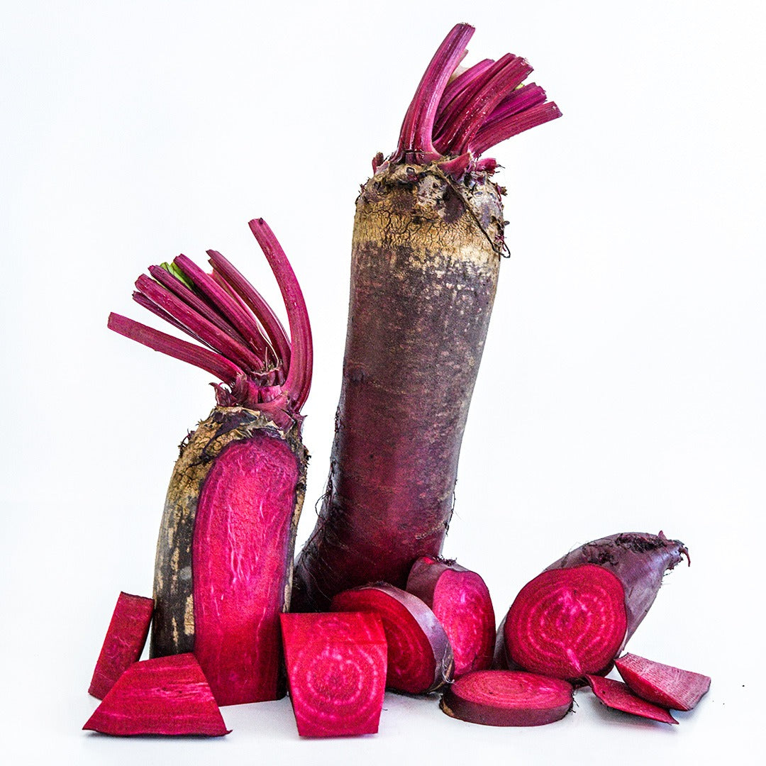Sliced and whole Renova Beets against a white background.
