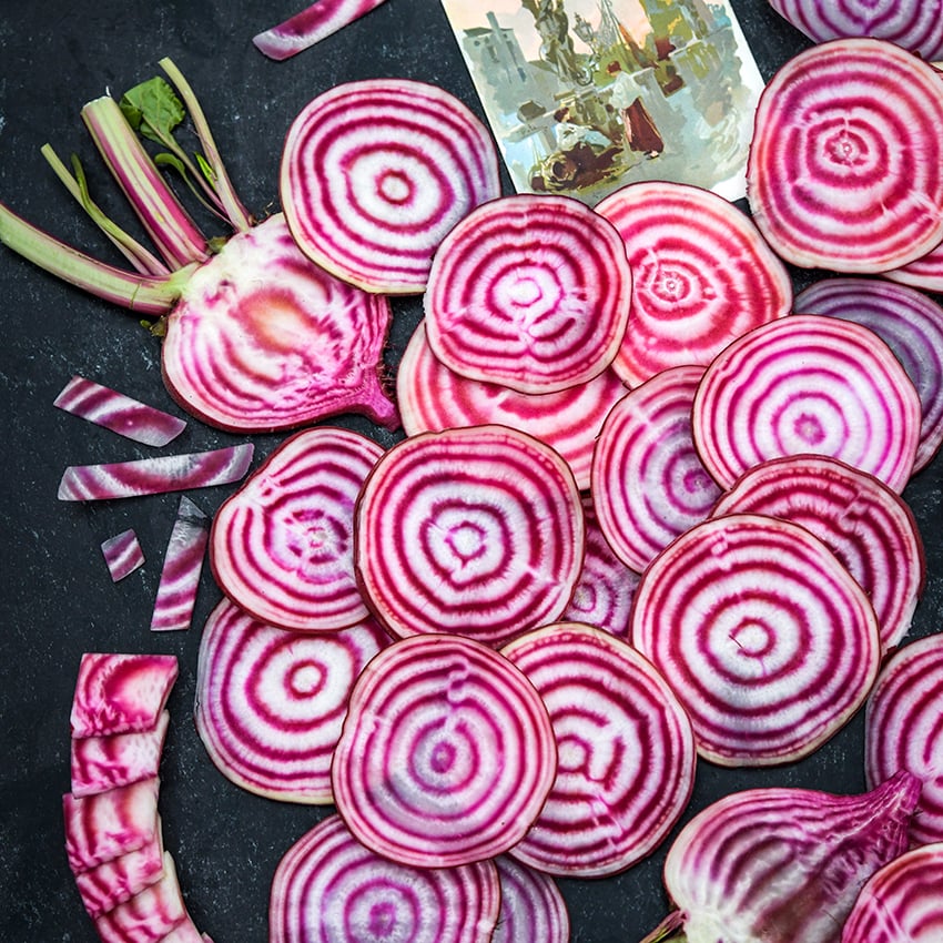 A variety of Chioggia (Bassano) Beet slices with a postcard from Chioggia, Italy.