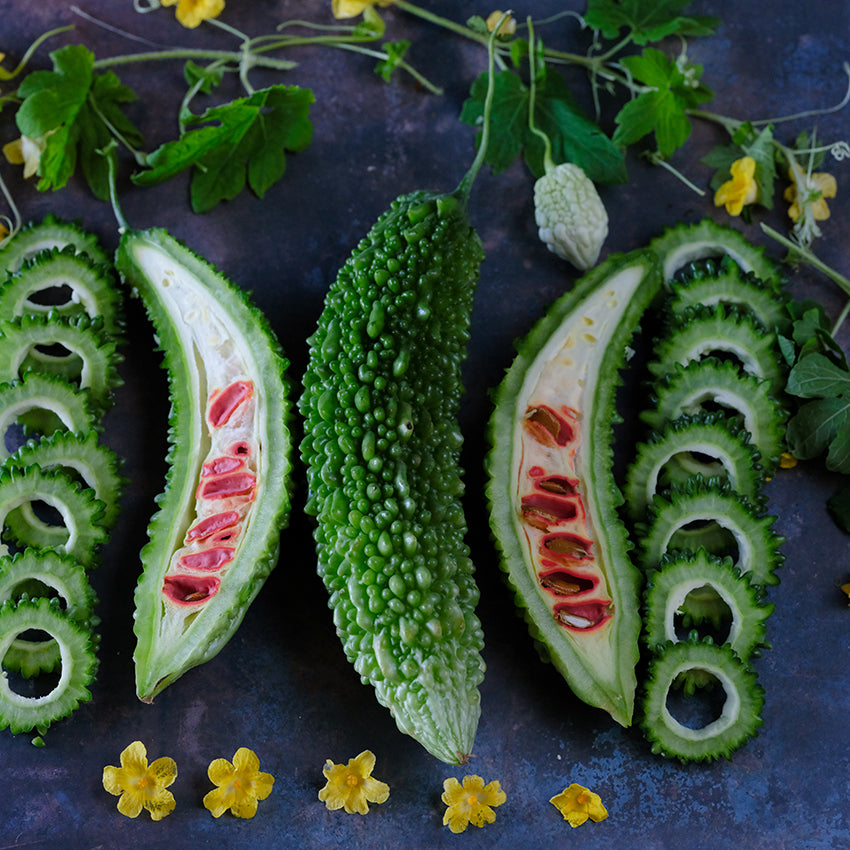 Ganjyu Bitter Melon halved showing seeds and blossoms