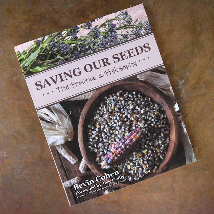 Saving Our Seeds By Bevin Cohen book on a brown background.