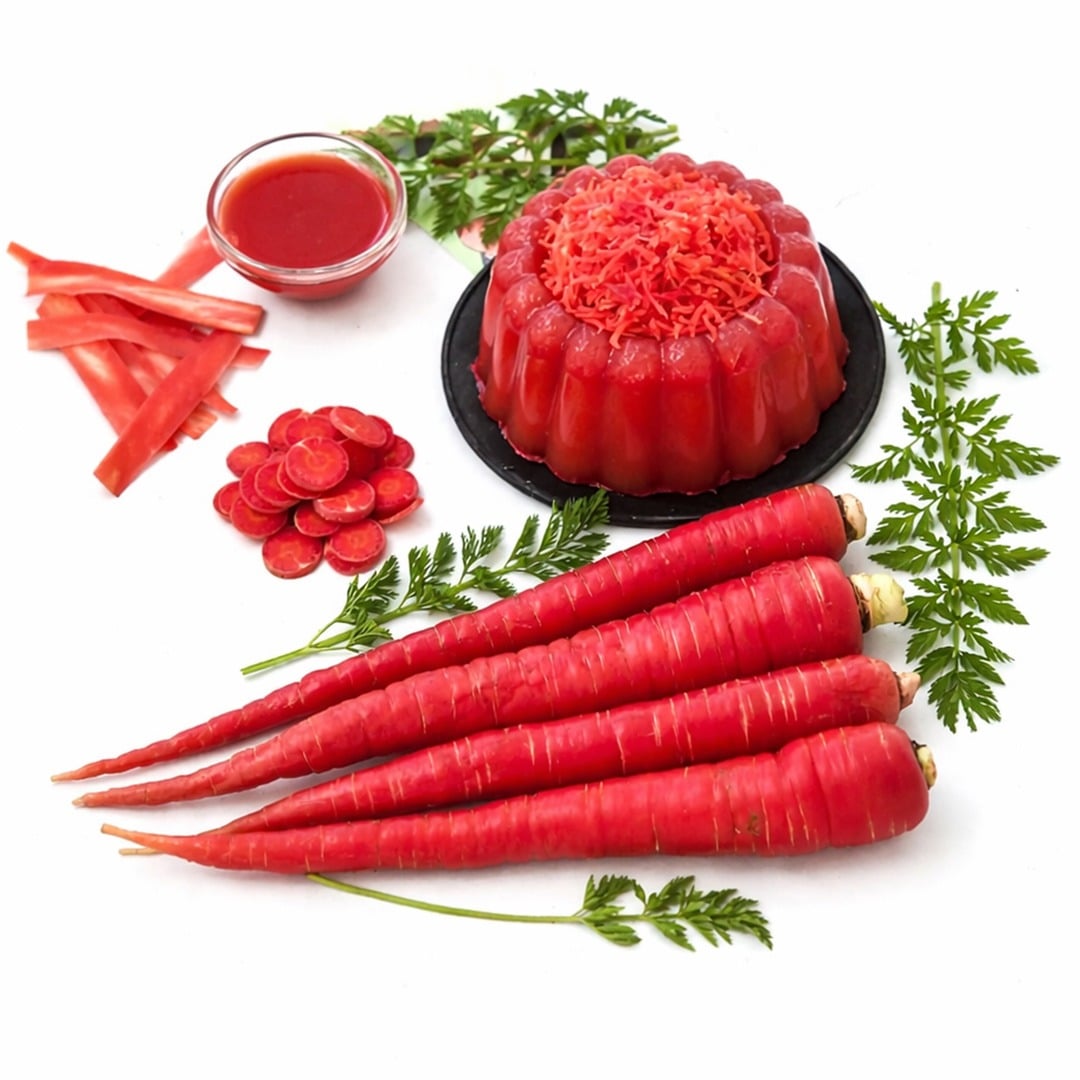 Kyoto Red carrots with jello on and foliage on a white background.