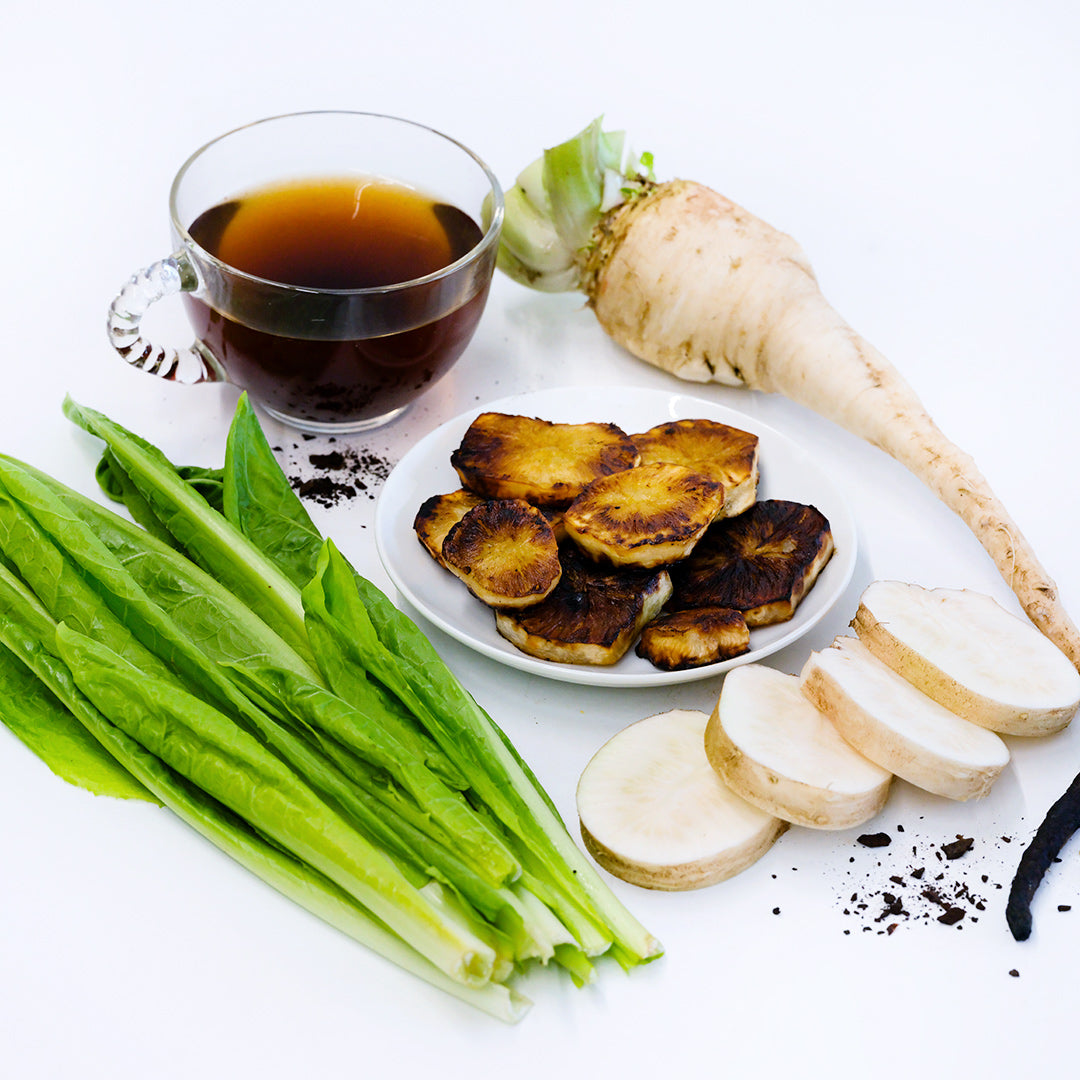 Chiavari Chicory coffee with leaves and fresh and roasted roots with leaves on a white background.