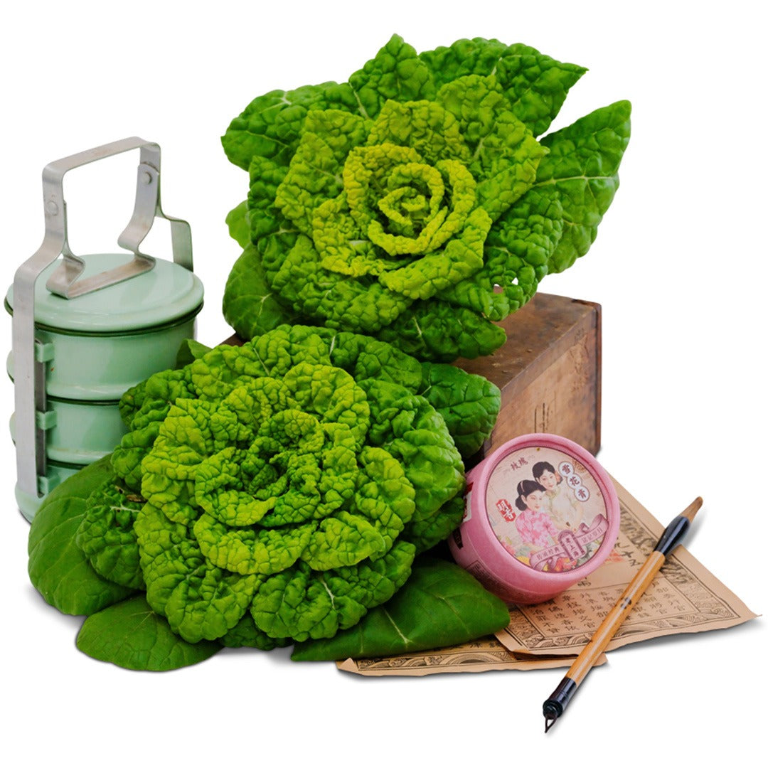 Pair of Yellow Heart Winter Choy on a wooden box with props on a white background.