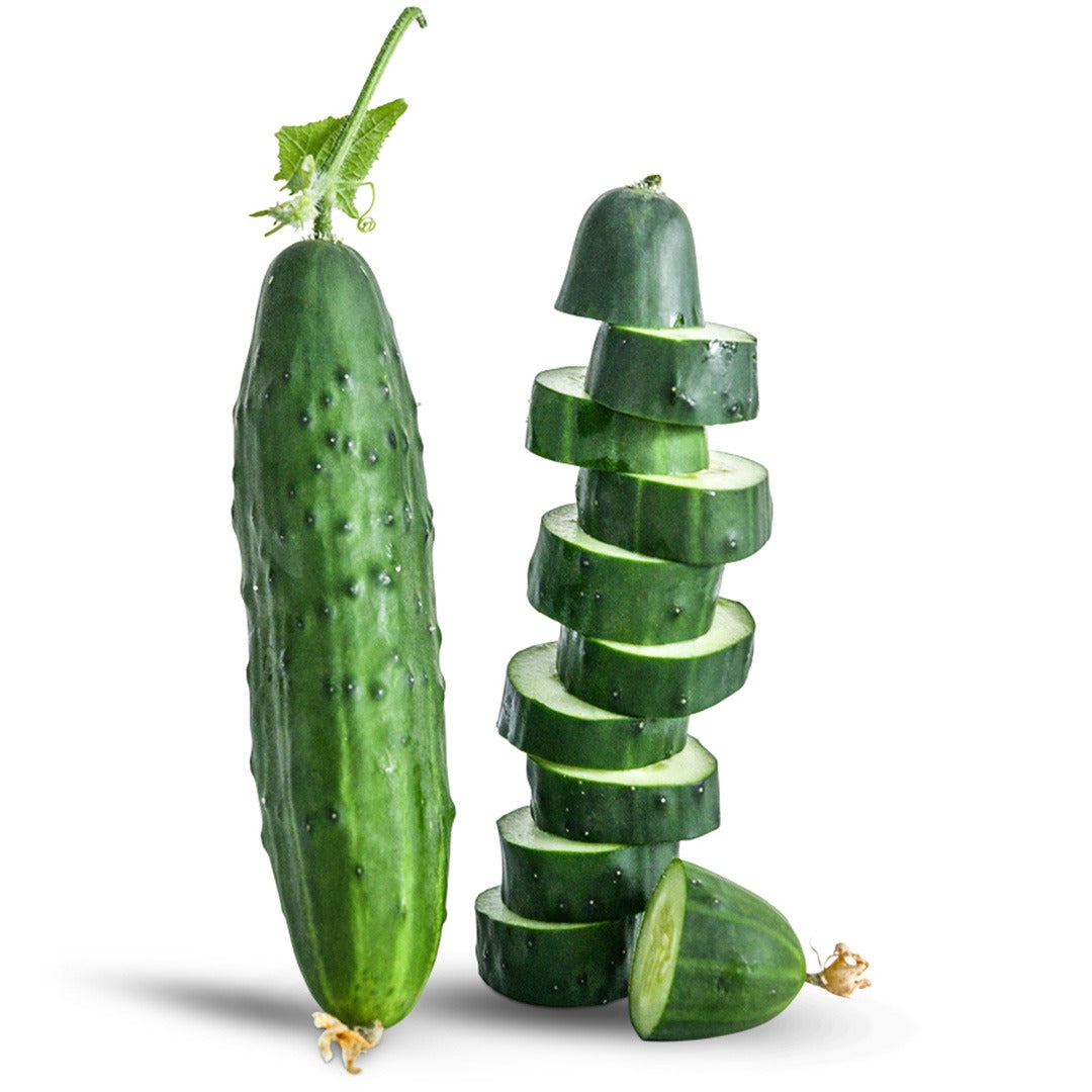 Whole Ancash cucumber next to a stack of sliced cucumbers on a white background