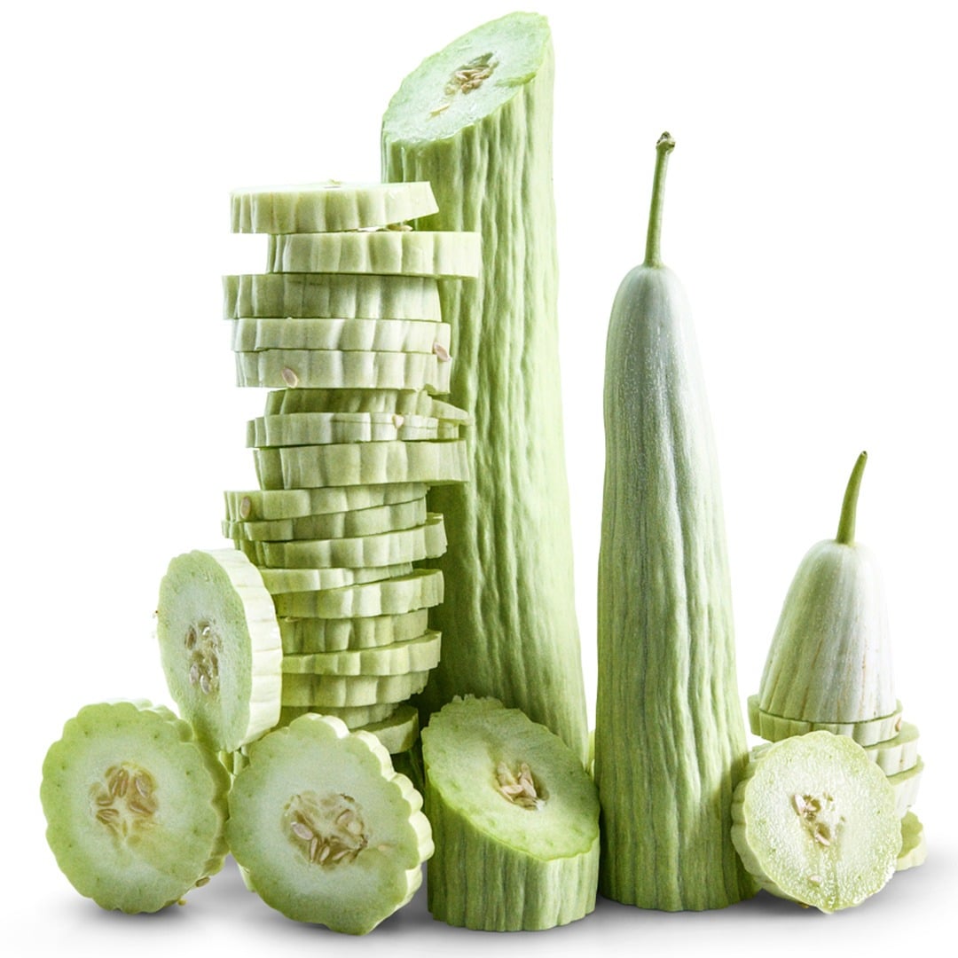 Whole and sliced Armenian Yard Long Cucumbers on a white background.