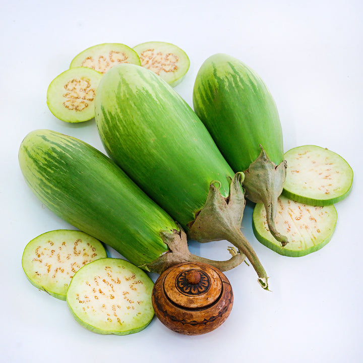 A trio of Giant of Barman Eggplants with slices on a white background.
