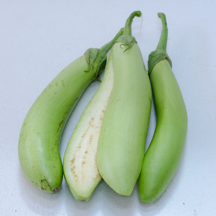 Satsuma White Eggplant, whole and halved.