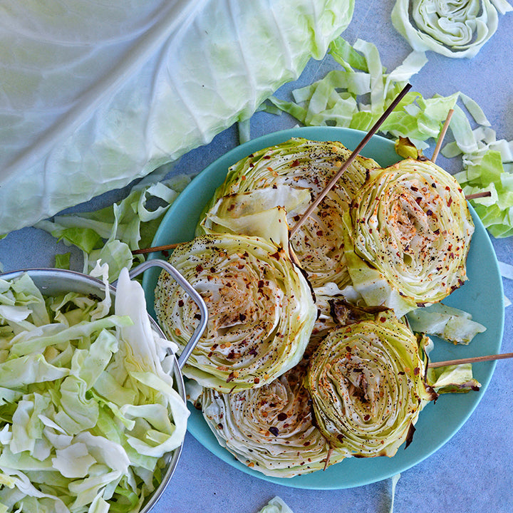 Roasted and seasoned cabbage steaks made from Filderkraut Cabbage slices.