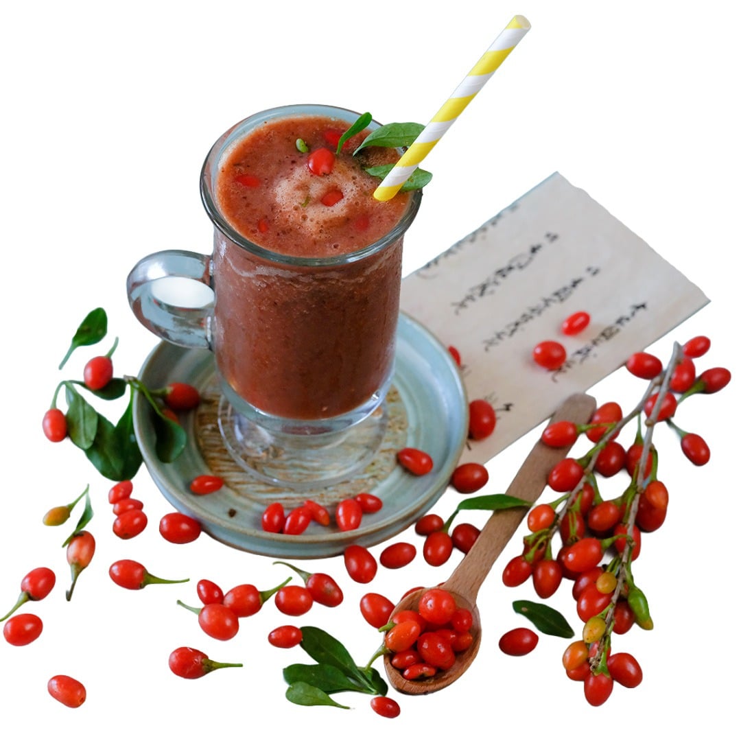 Scarlet Goji Berries with a smoothie on a white background.