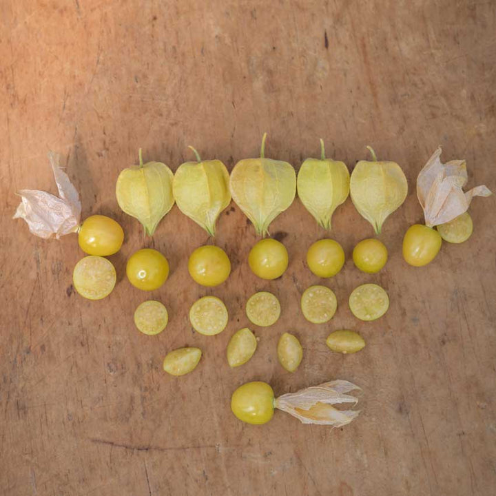 Several Aunt Molly's Ground Cherries, whole, sliced and quartered.