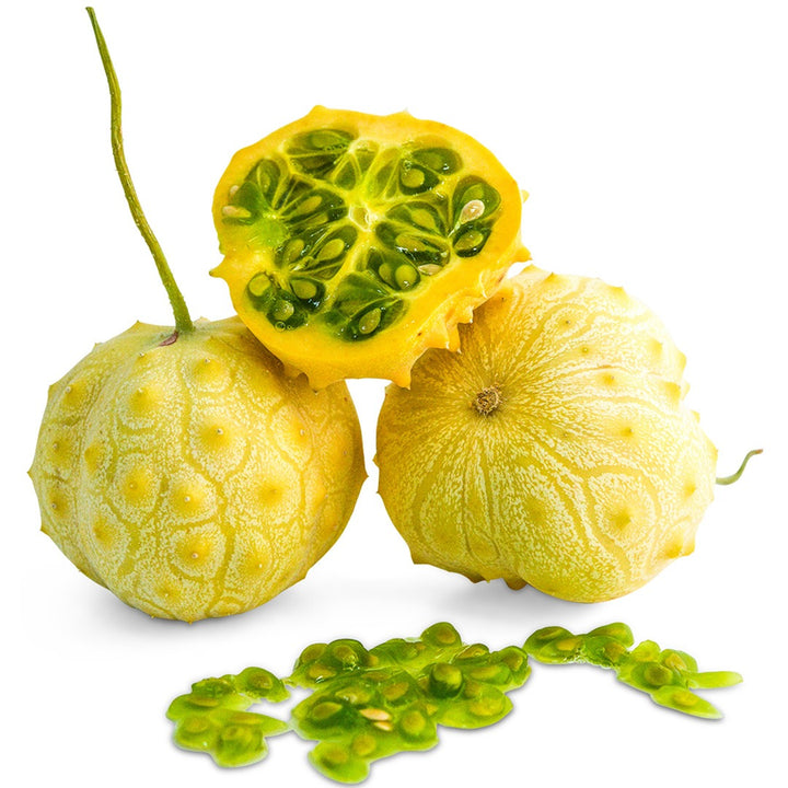 Whole and cut Kiwano Rund Jelly Melons on a white background.