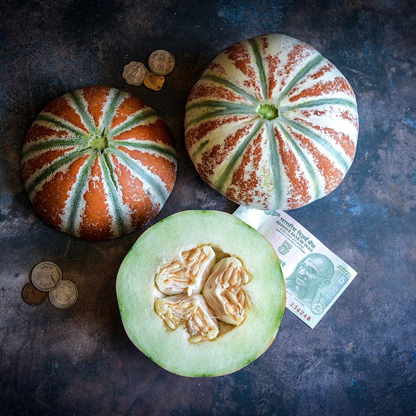 Kajari Melon sliced in half across diameter.