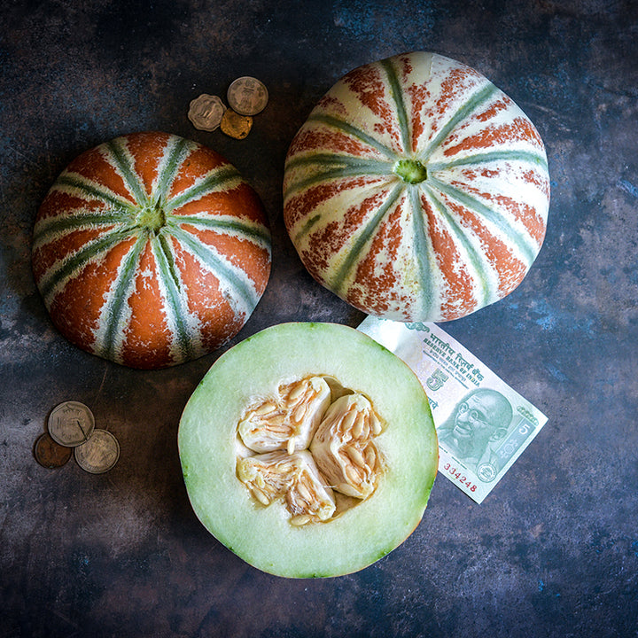 Kajari Melon sliced in half across diameter.