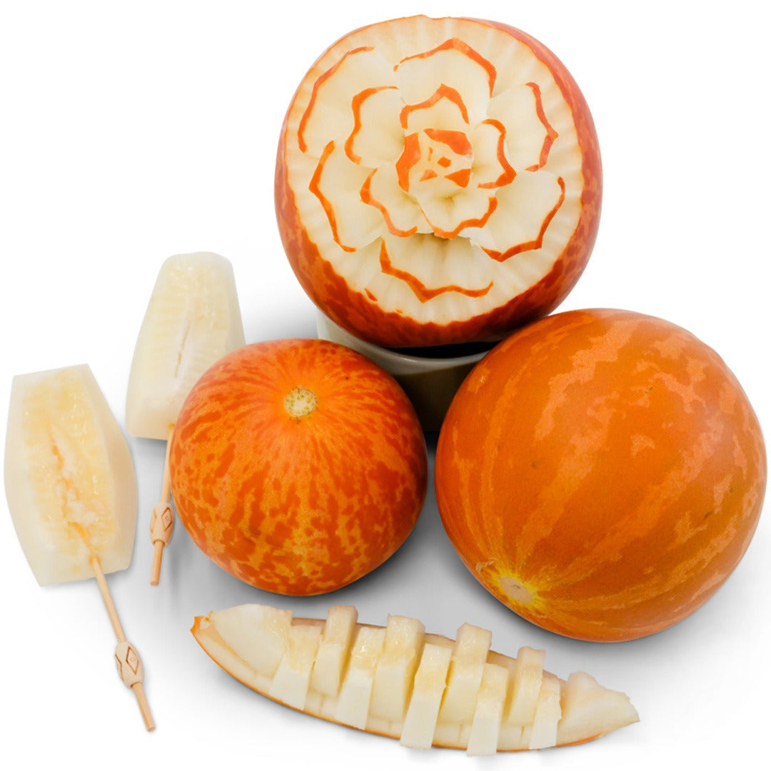 Tigger Melon with intricate floral carving on a white background.