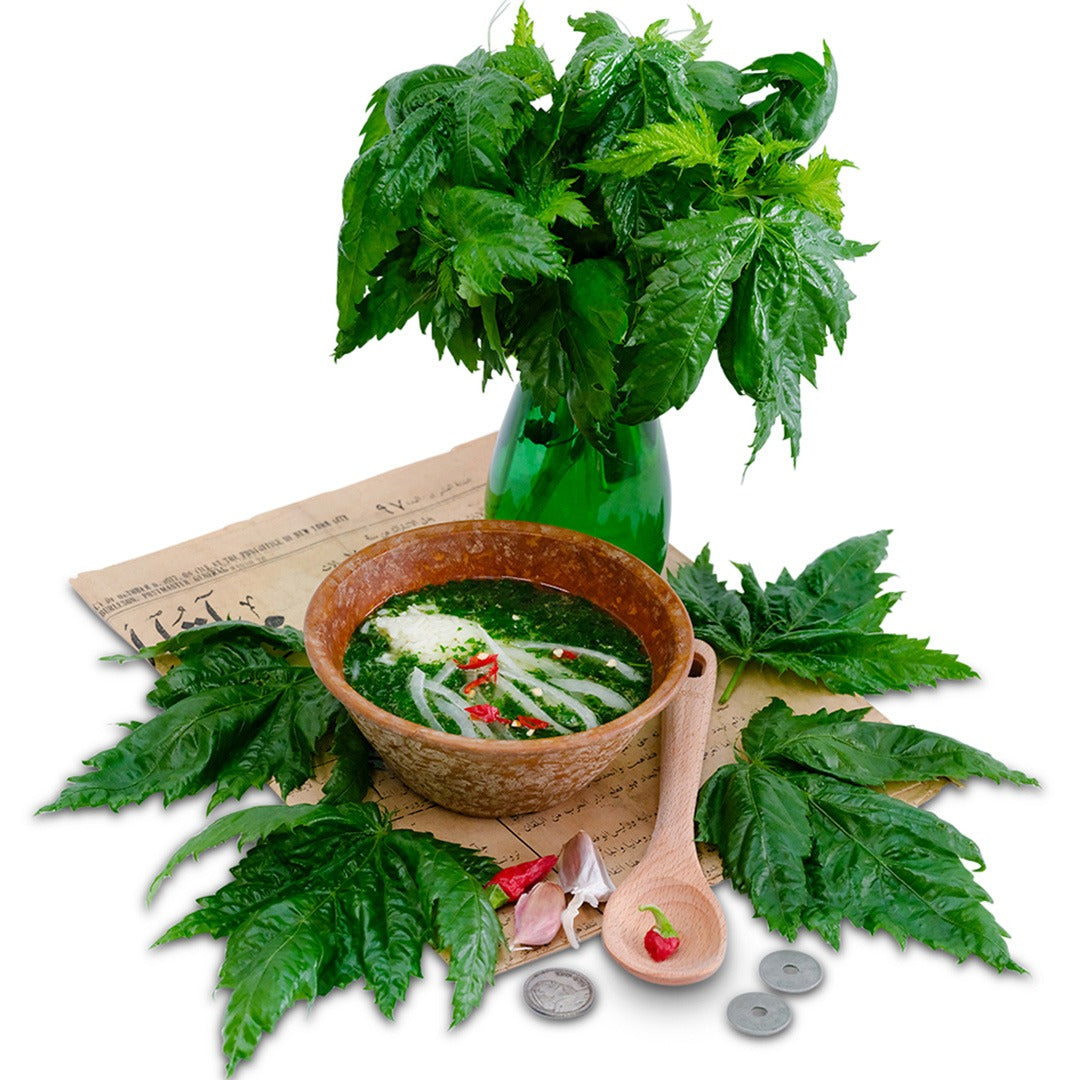 Oniyaya Molokhia recipe in a bowl with leaves in a vase.
