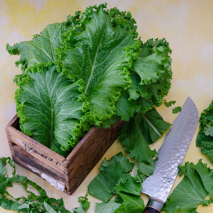 Green Wave Mustard leaves in wooden box.