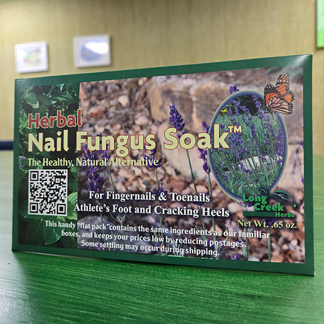 Herbal Nail Fungus Soak in packaging on white background.