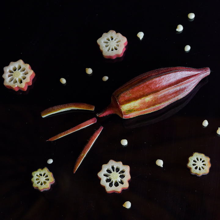Alabama Red Okra pods and slices in decorative rocket shape.