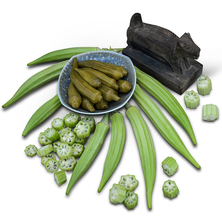 Cut and whole Burmese Okra on a white background.