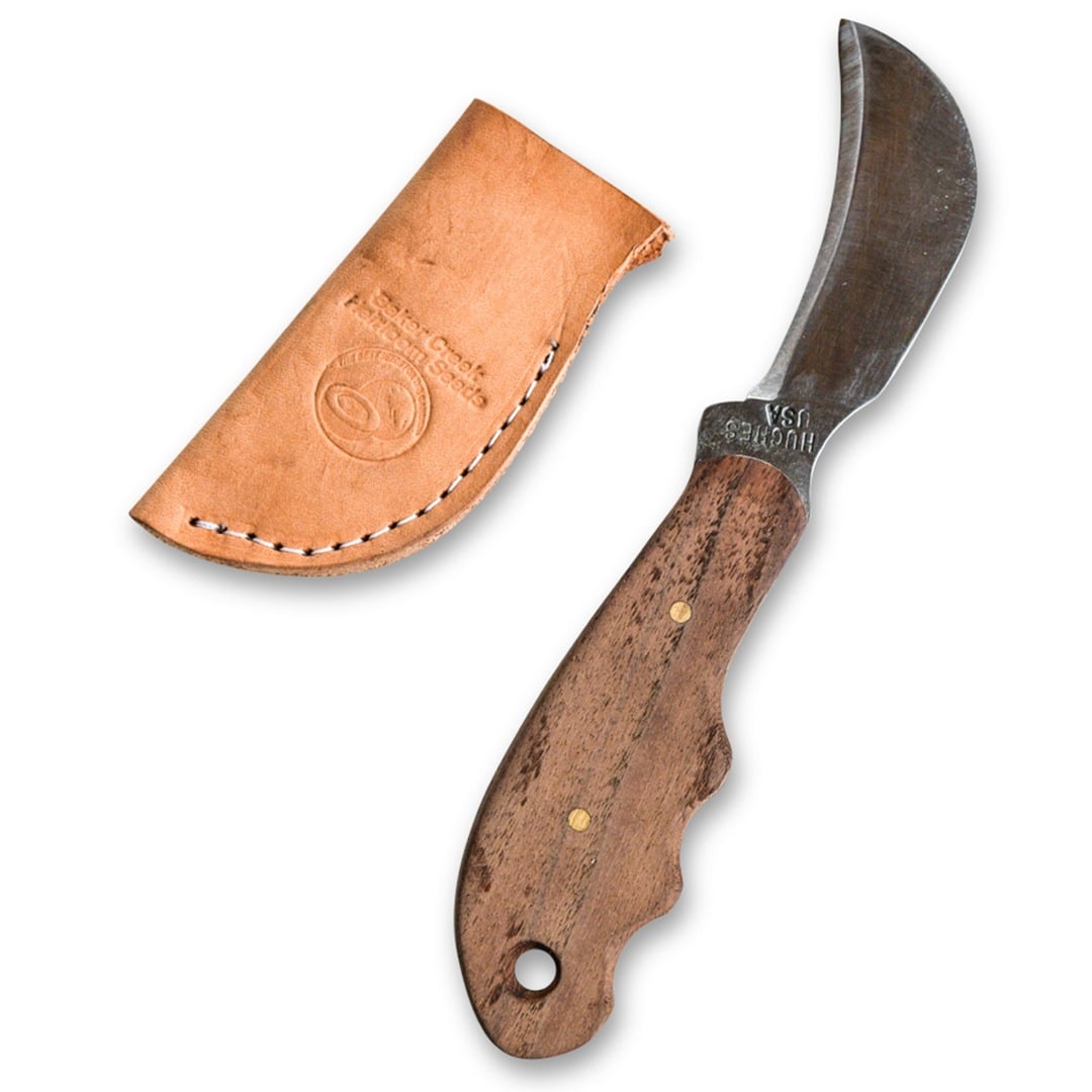 Ozarks Harvest Knife with leather sheath on a white background
