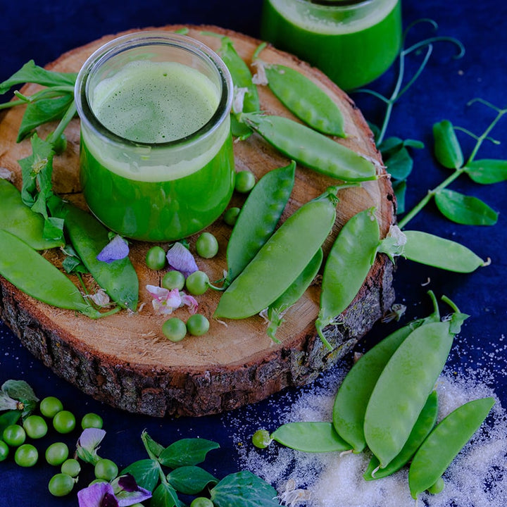 Mammoth Melting Sugar Snap pea on wooden plank.