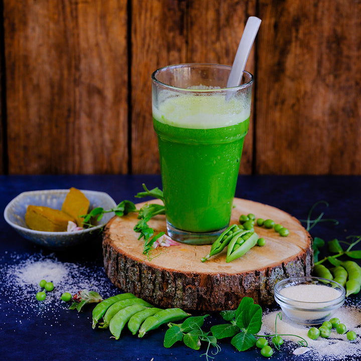 Sugar Daddy Snap Pea with pea juice and pudding desert on a dark blue background.