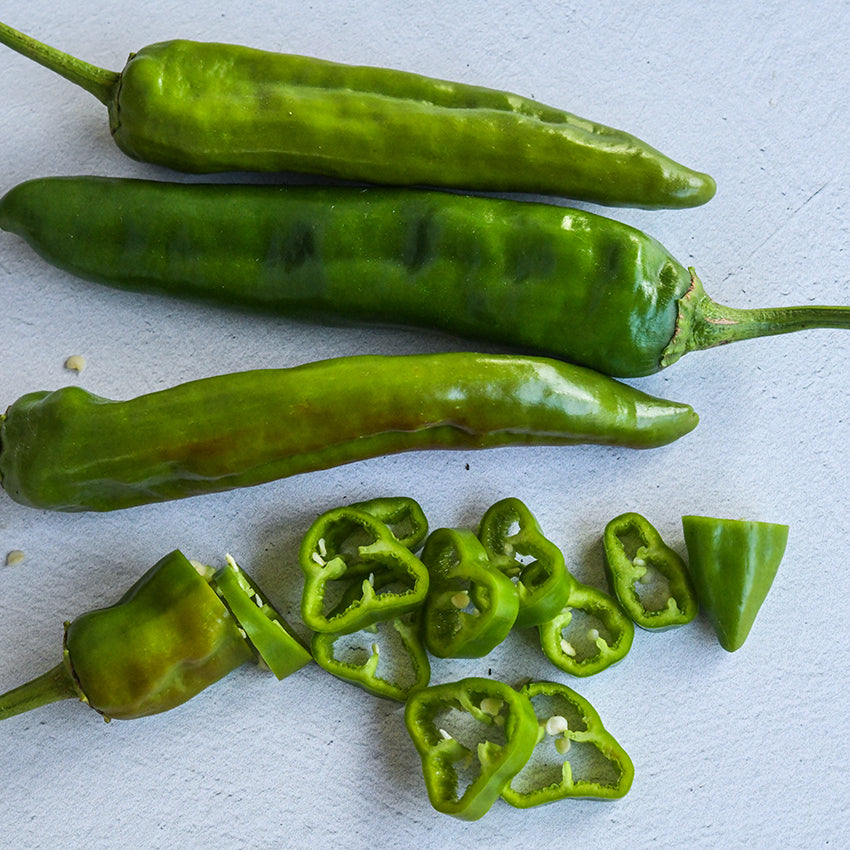 Anaheim Peppers, whole and sliced.