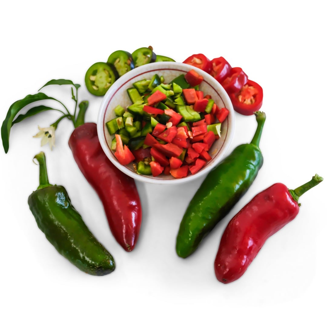 Palmetto Punch Hot Peppers with a white bowl full of cut peppers on a white background.