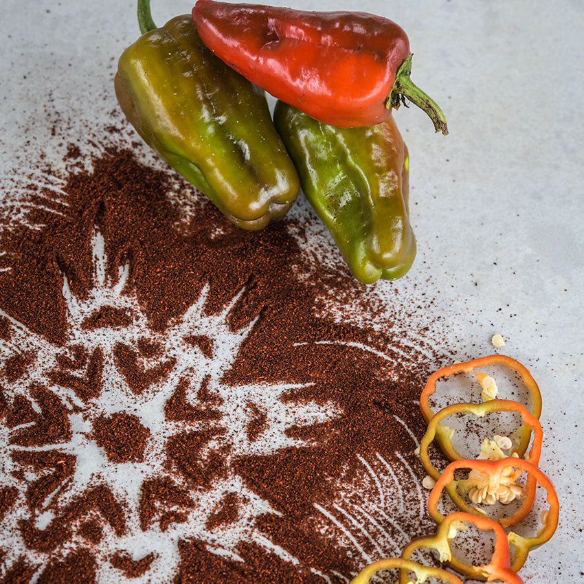Leutschauer Paprika Pepper with slices and ground pepper with mandala design.