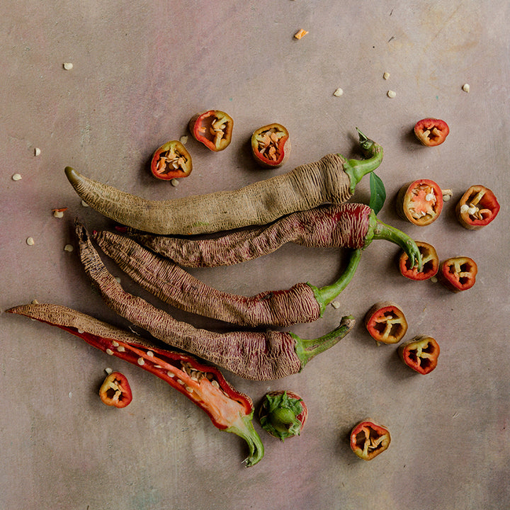 Rezha Macedonian Peppers with slices on light background.