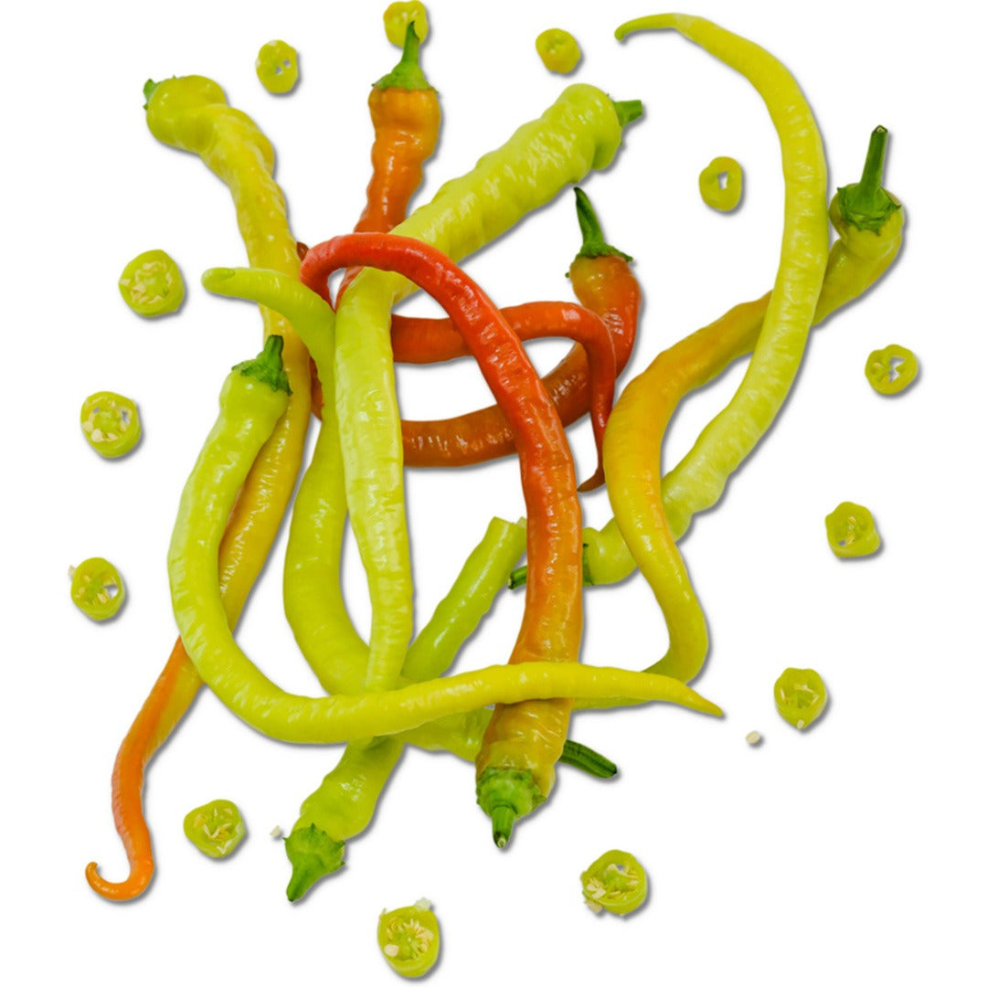Sliced and whole Corbaci Sweet Peppers on a white background.