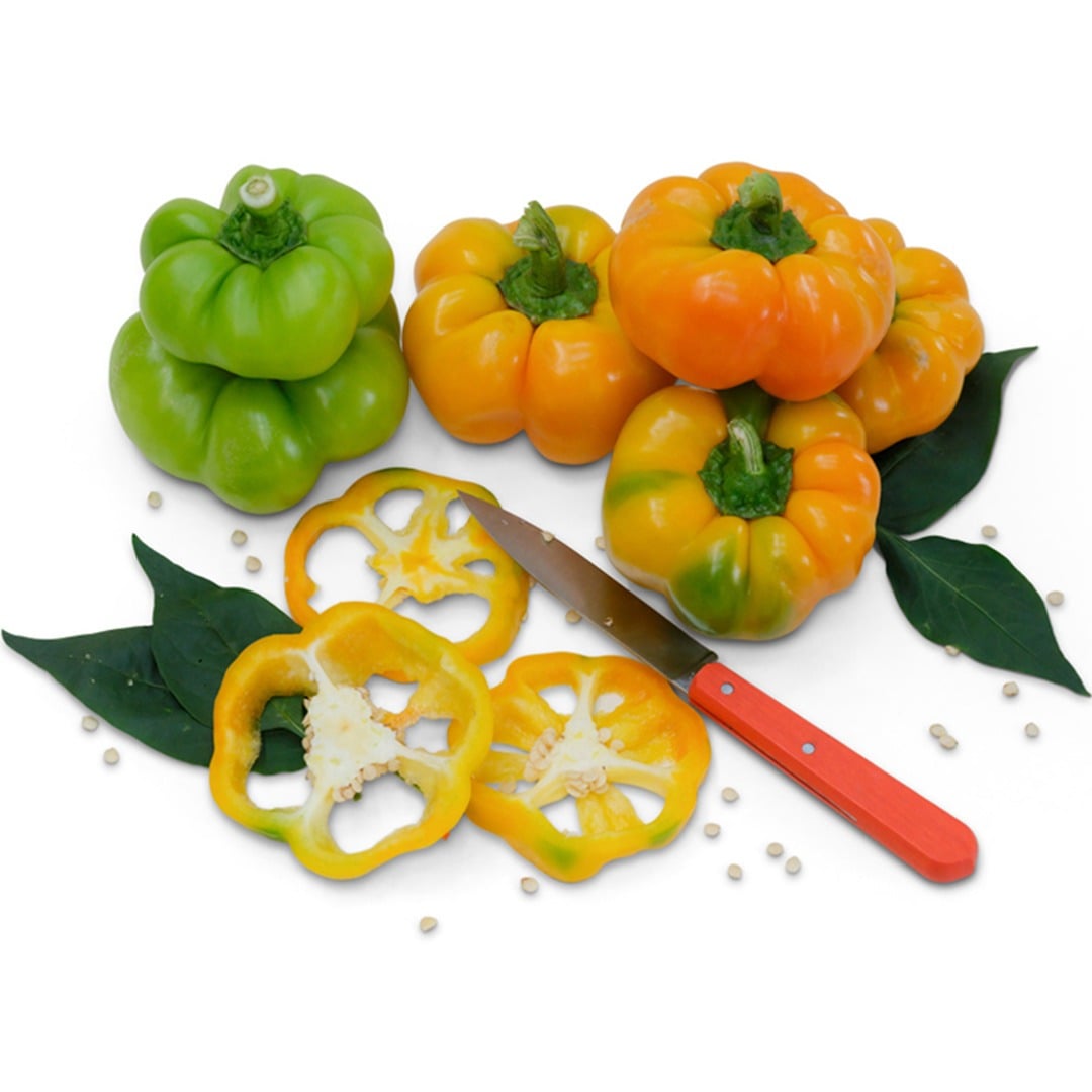 Whole and sliced Paradicsom Alaku Sweet Peppers on a white background.