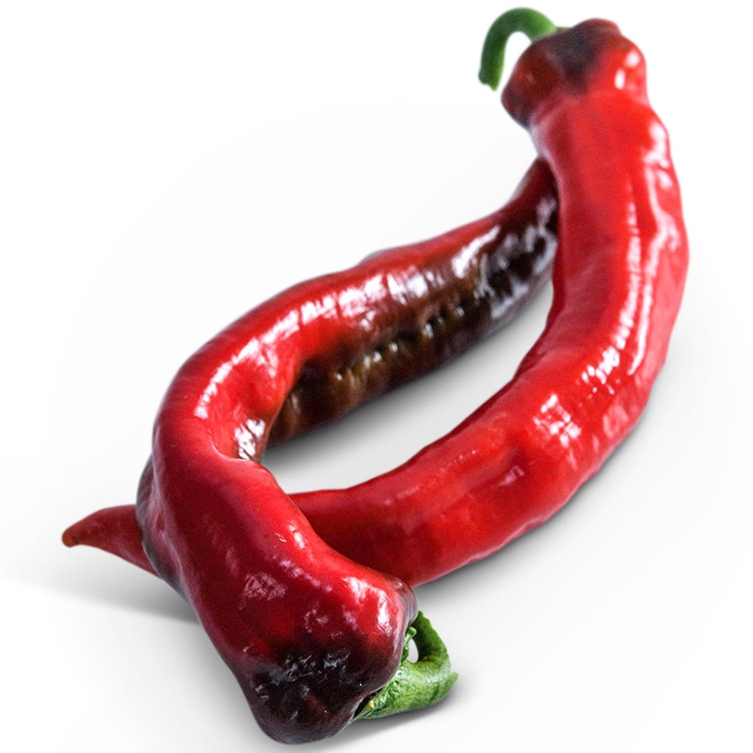 Pair of Txorixero Sweet Peppers on a white background.