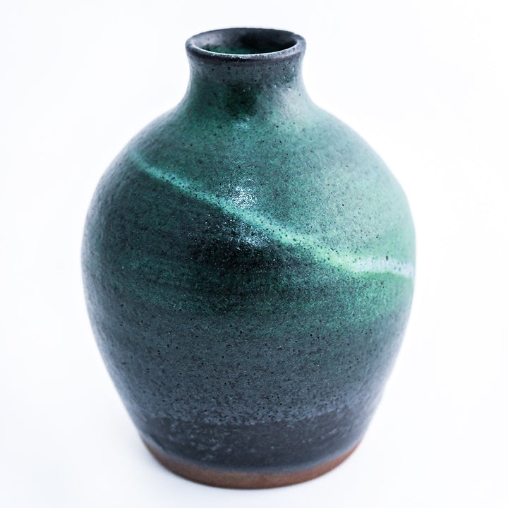 The back side of a Handmade Mini Stoneware Bud Vase on a white background.