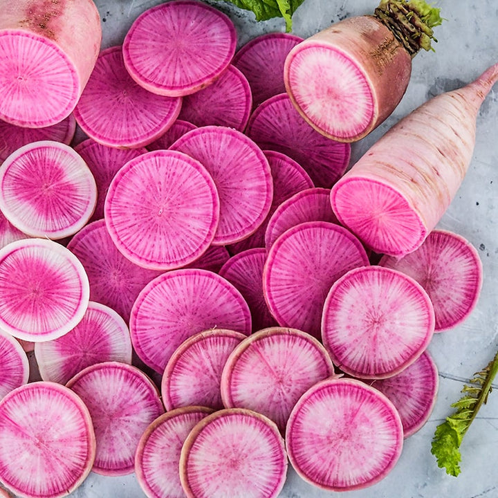Cut Pusa Gulabi Radishes on a light background.