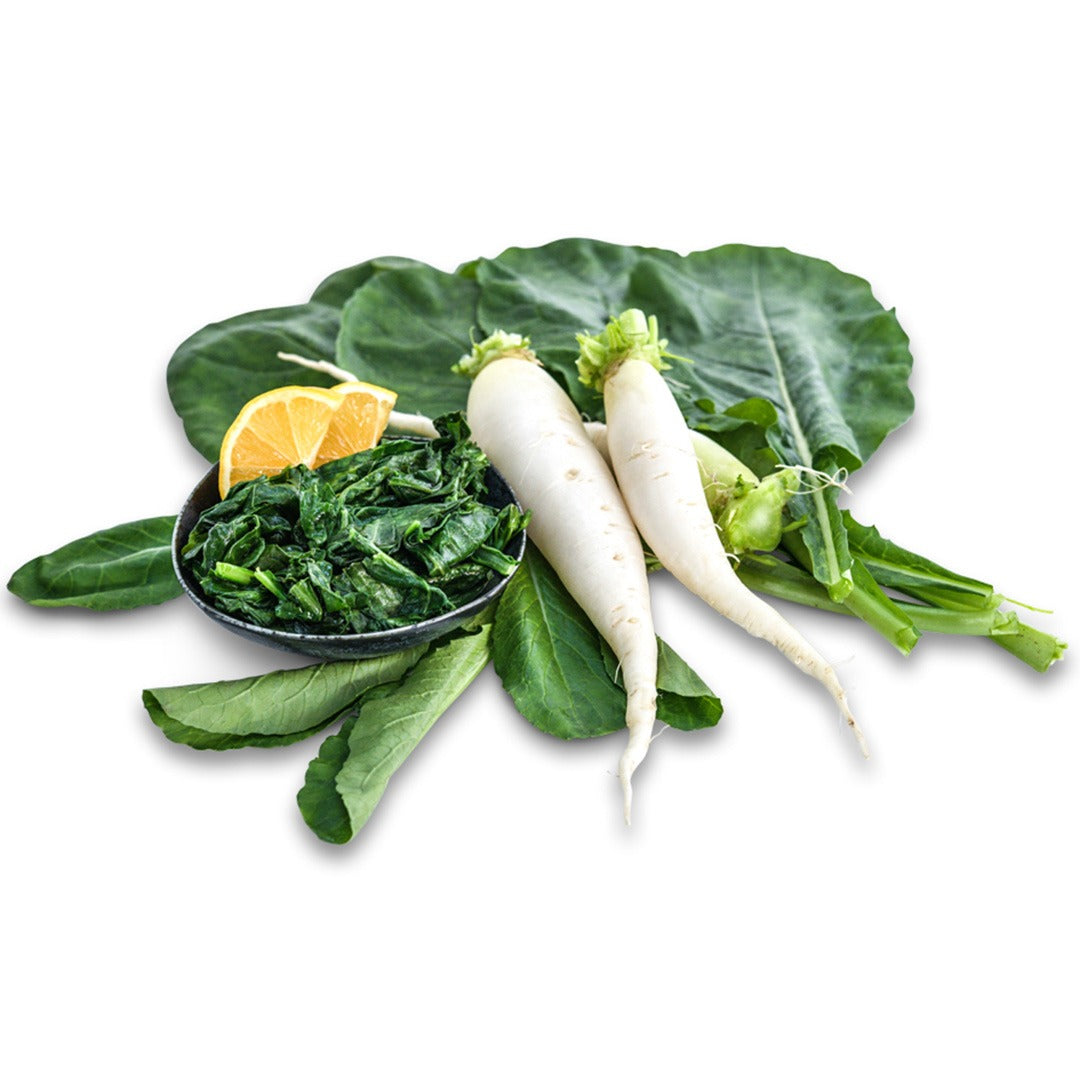 China Jade Radishes with sauteed spinach in a dish on a white background.