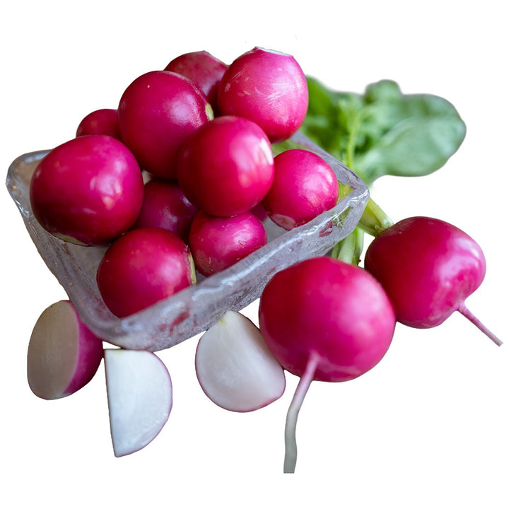 Pink Beauty Radishes in a clear bowl on a white background.