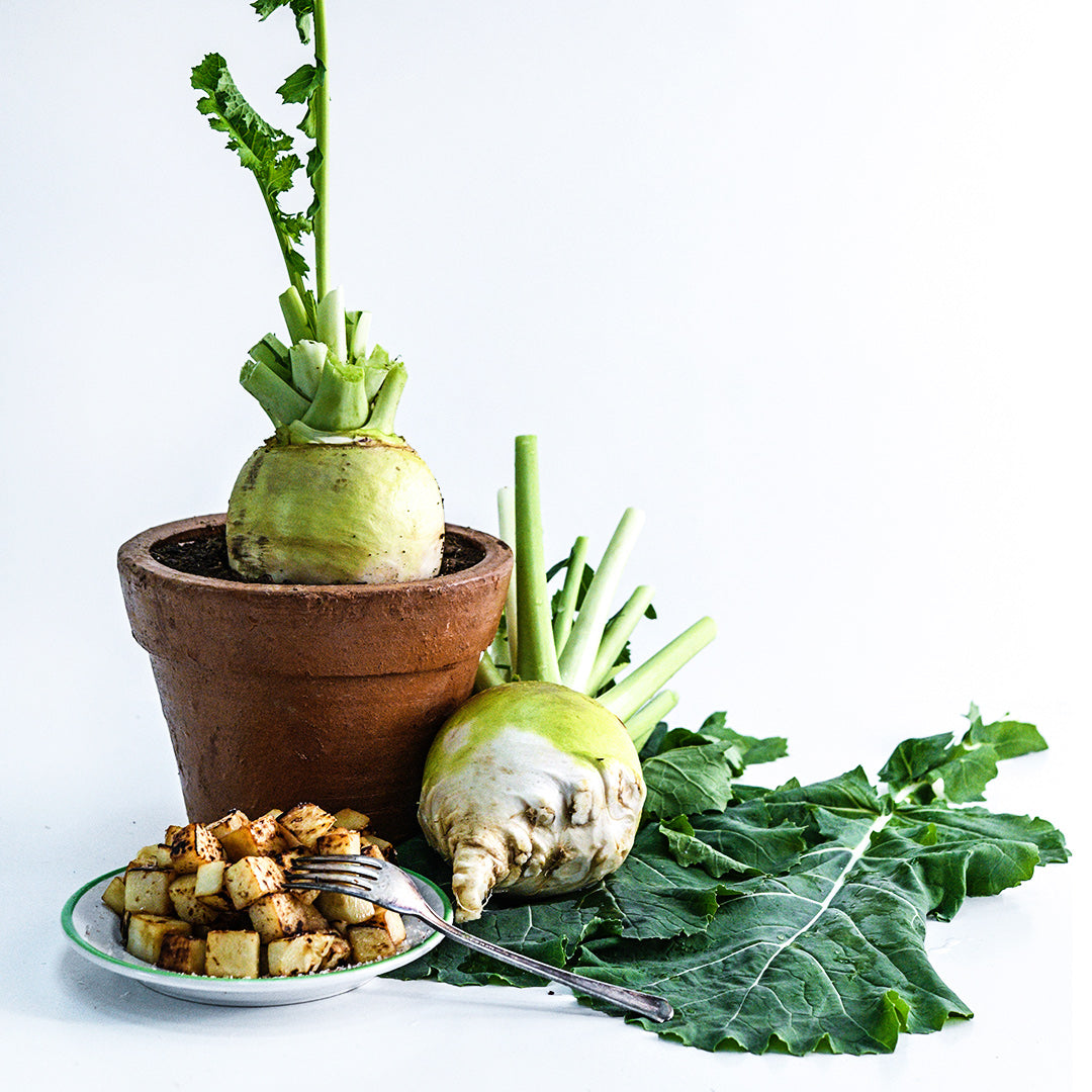 A Macomber Turnip Rutabaga in a pot with leaves, a recipe and roasted rutabaga.