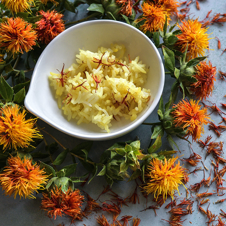 Corrales Azafran Safflowers around bowl of rice with light background