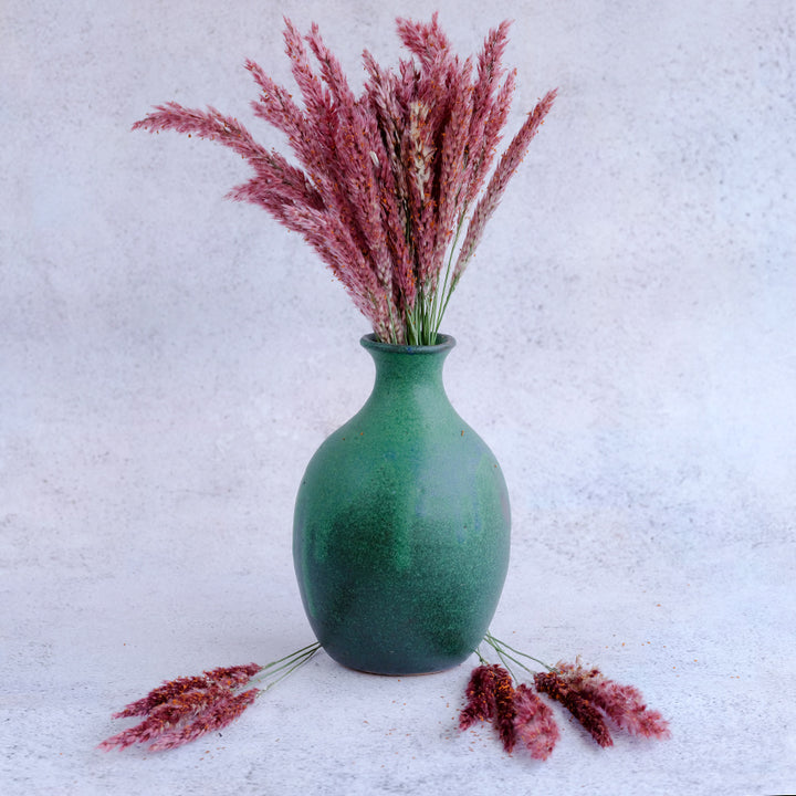 Savannah Grass in a handmade ceramic vase on a light background.