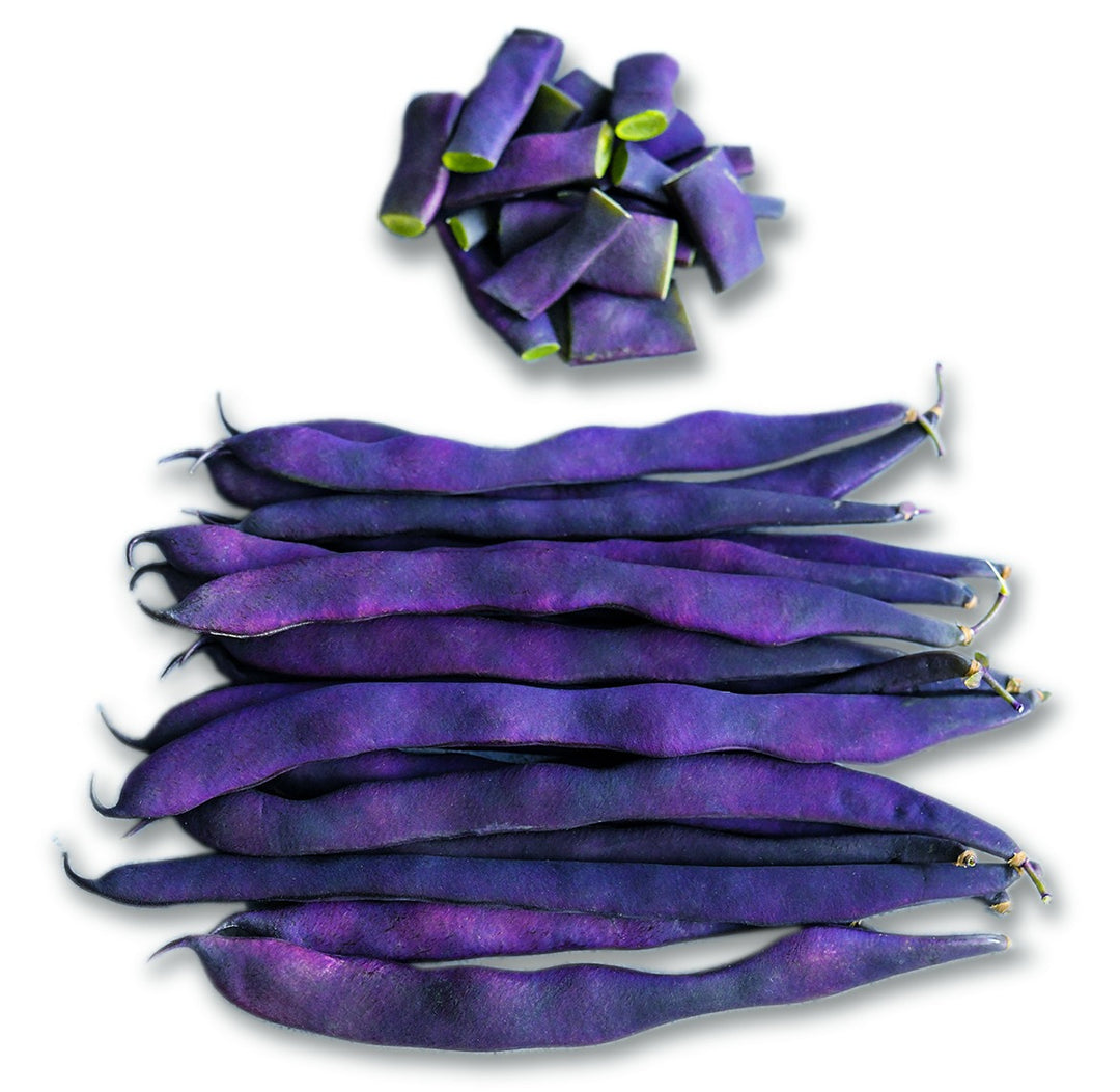 Cut and whole Purple Podded Pole Beans on a white background.