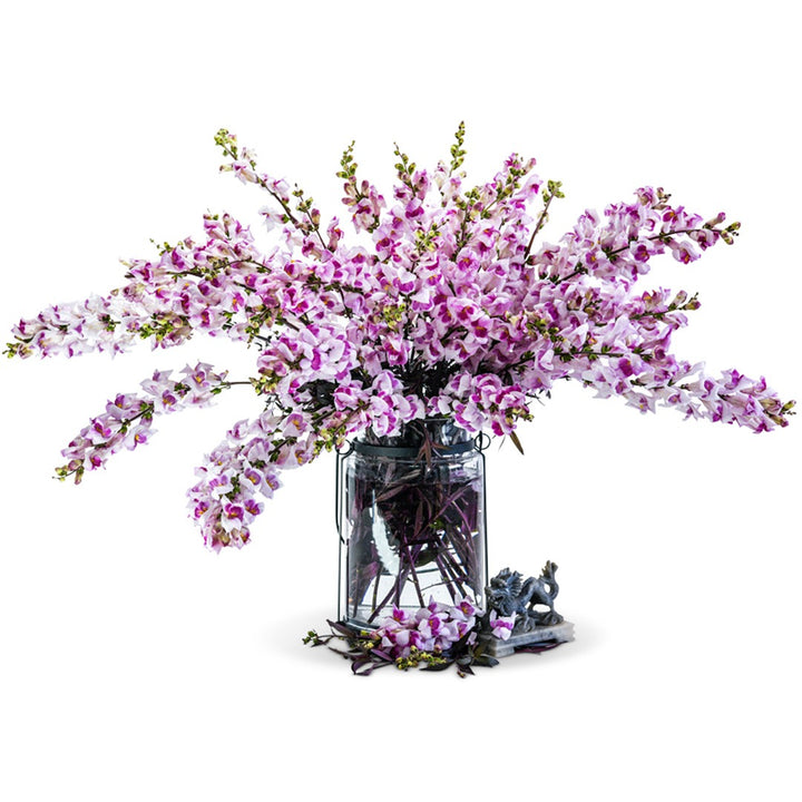 Bouquet of Bronze Dragon Snapdragon Flowers in a clear vase on a white background.