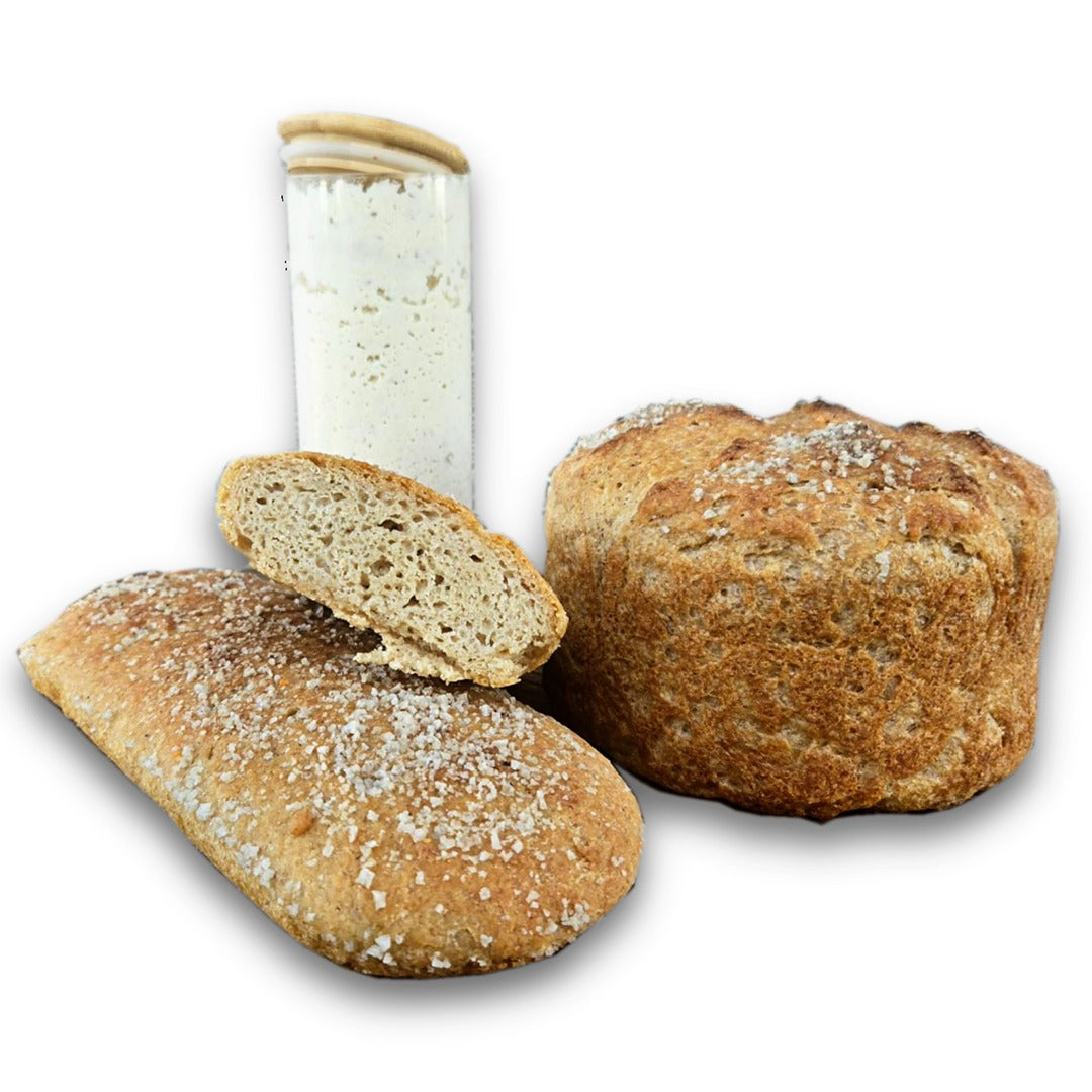 Amazing Sourdough Rice Starter with loaves of bread.