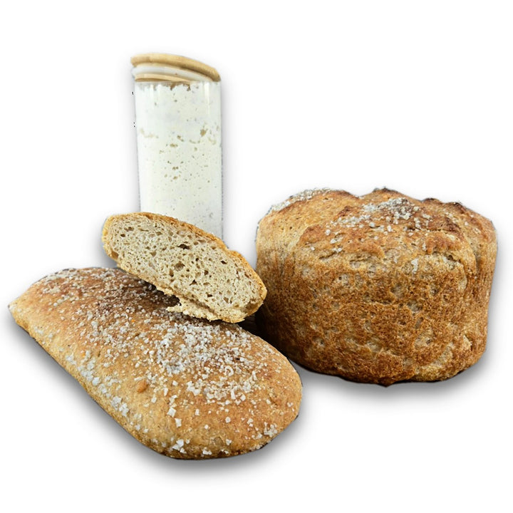 Amazing Sourdough Rice Starter with loaves of bread.