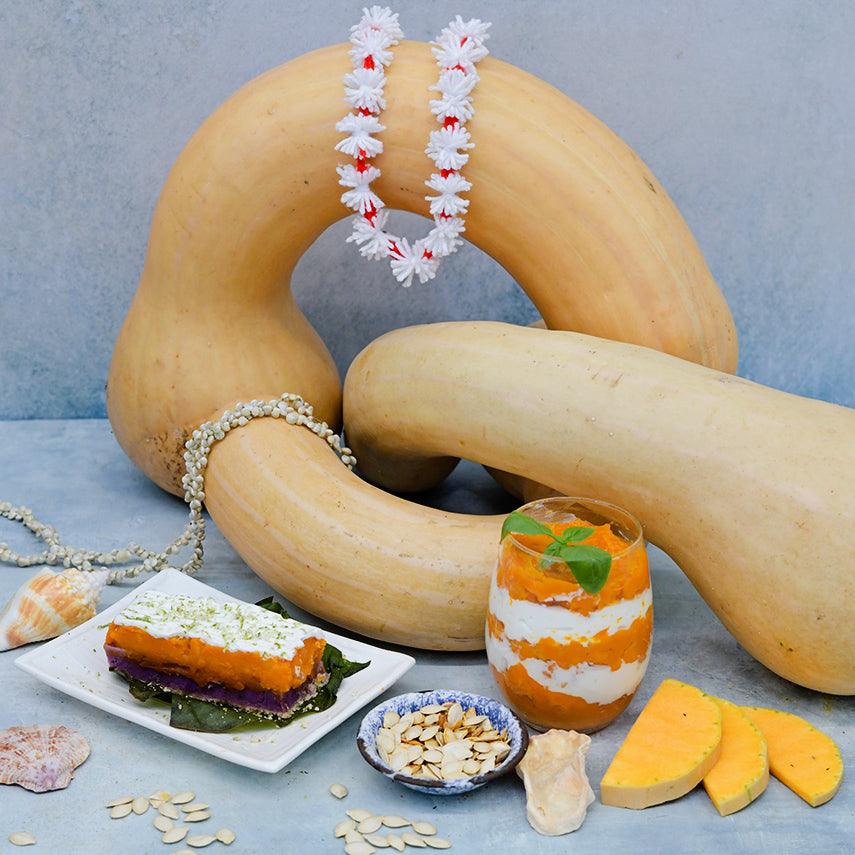 Tahitian Melon Squash with dessert recipes and seashells on a light background.